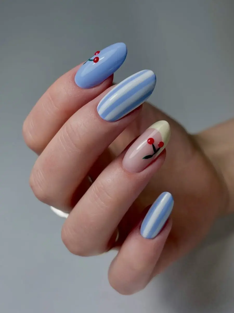 Charming cherry nails with blue and pastel tones