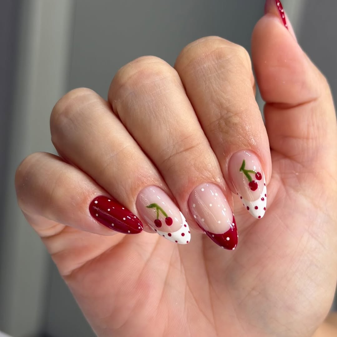 Vibrant cherry-inspired nail art for summer.