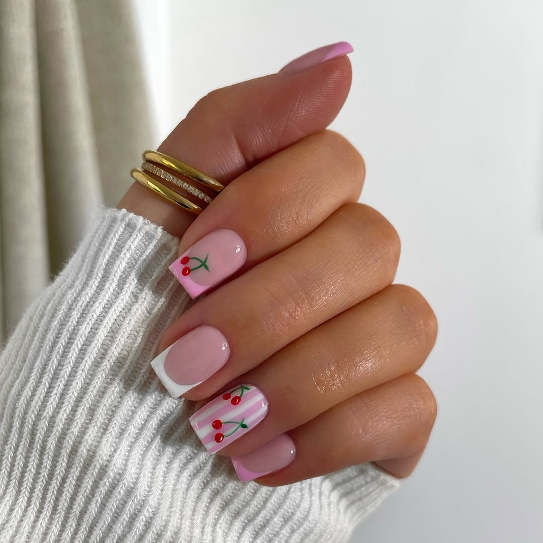Charming cherry design on trendy pink nails