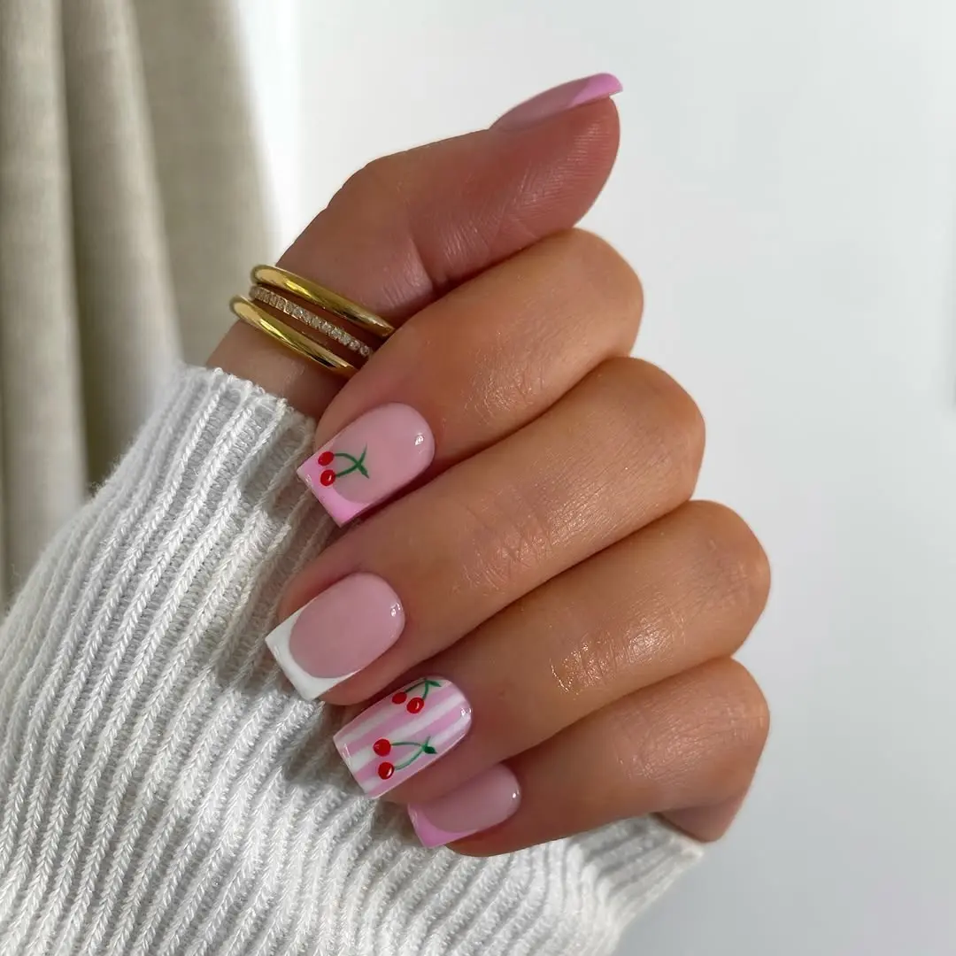 Charming cherry design on trendy pink nails
