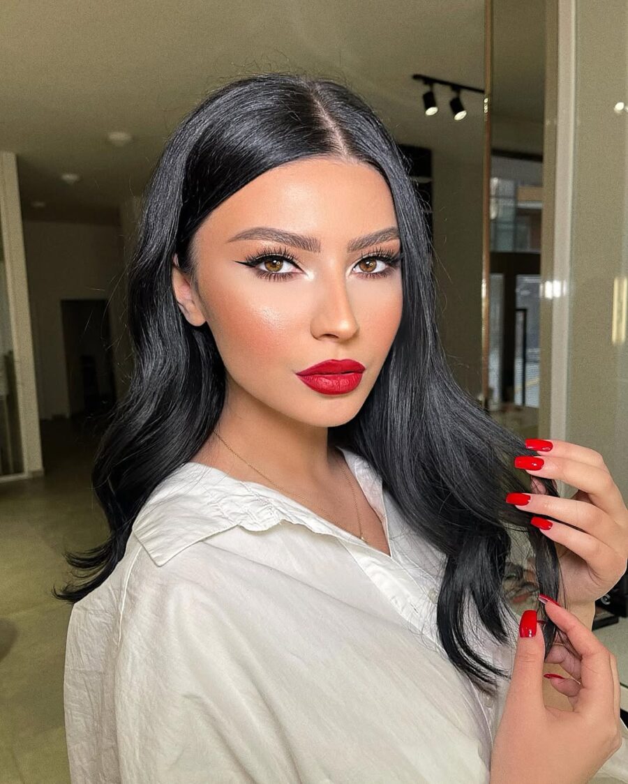 Bold red lips enhance glamorous makeup look