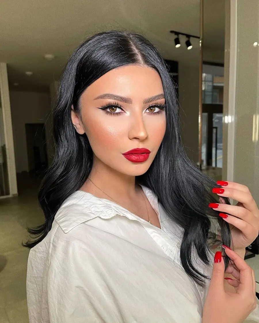 Bold red lips enhance glamorous makeup look