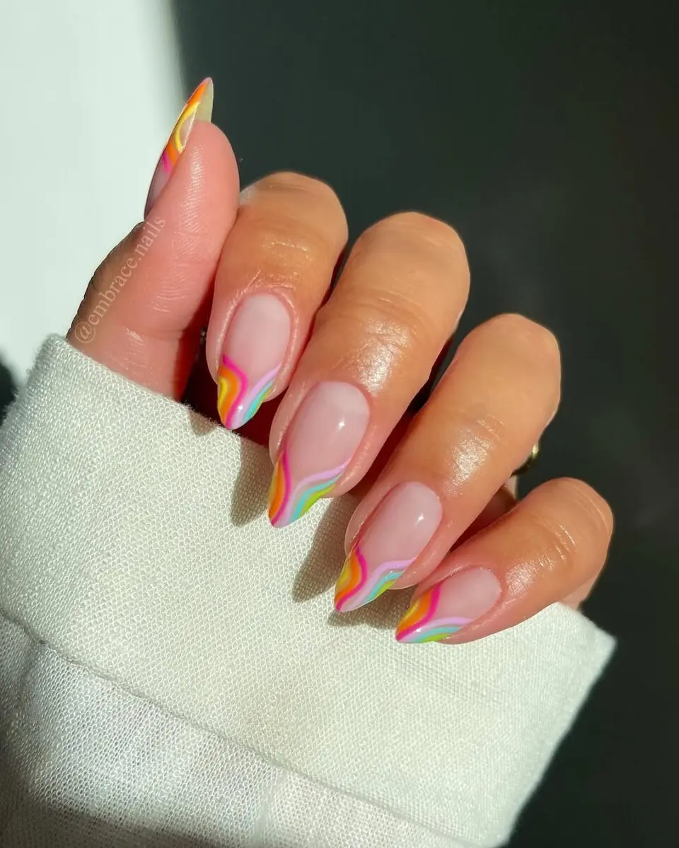 Vibrant swirls on elegant French tips