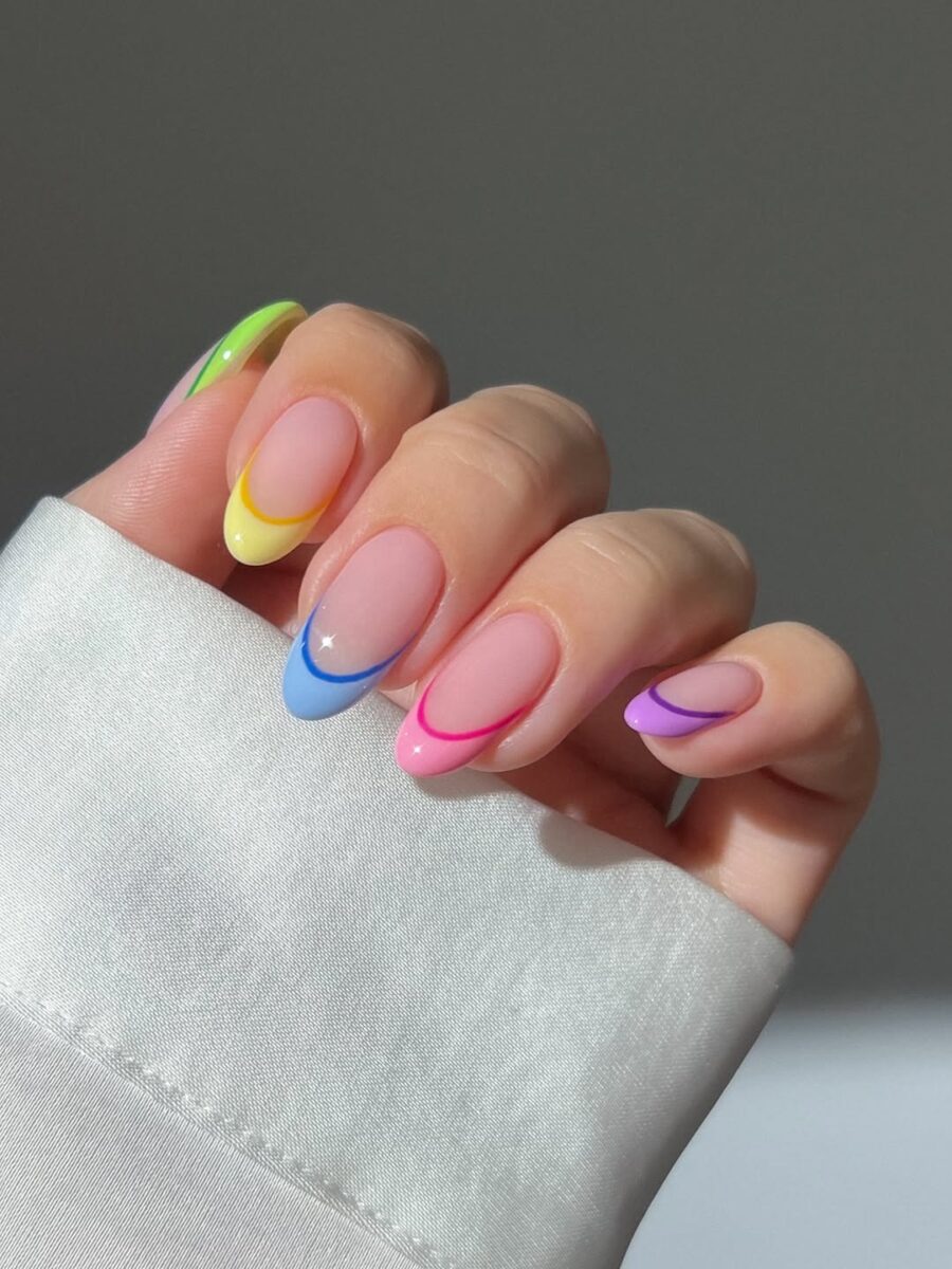 Vibrant rainbow French tip nail design