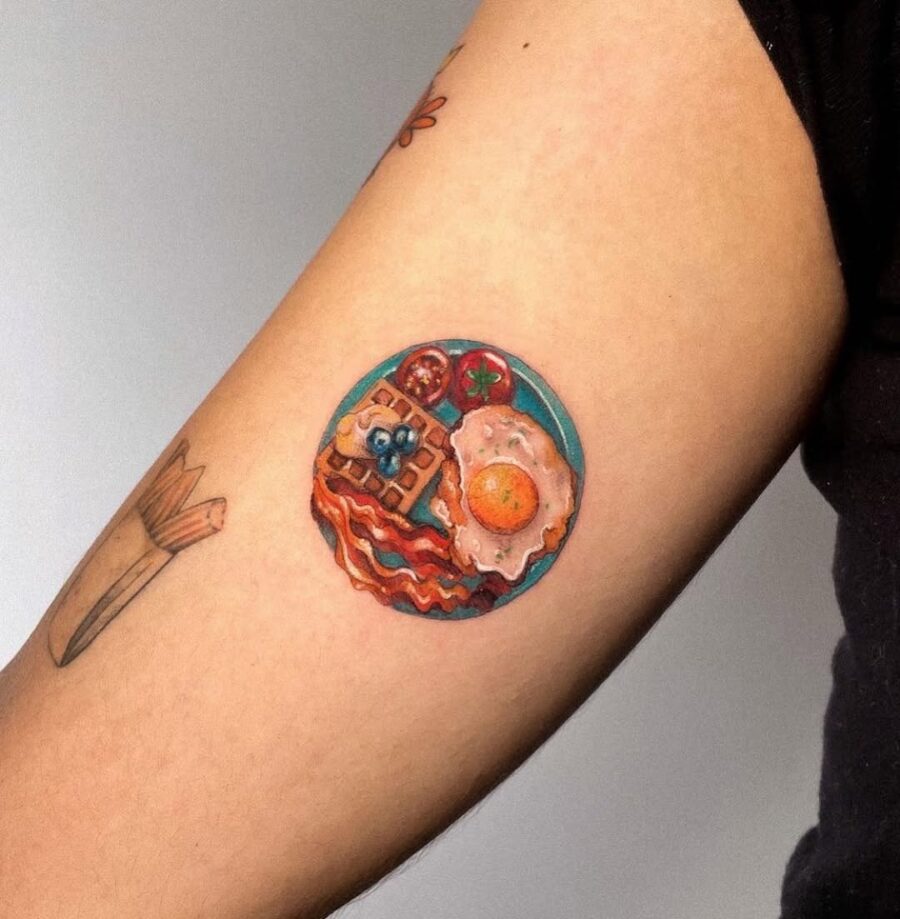 Whimsical waffle tattoo with breakfast elements
