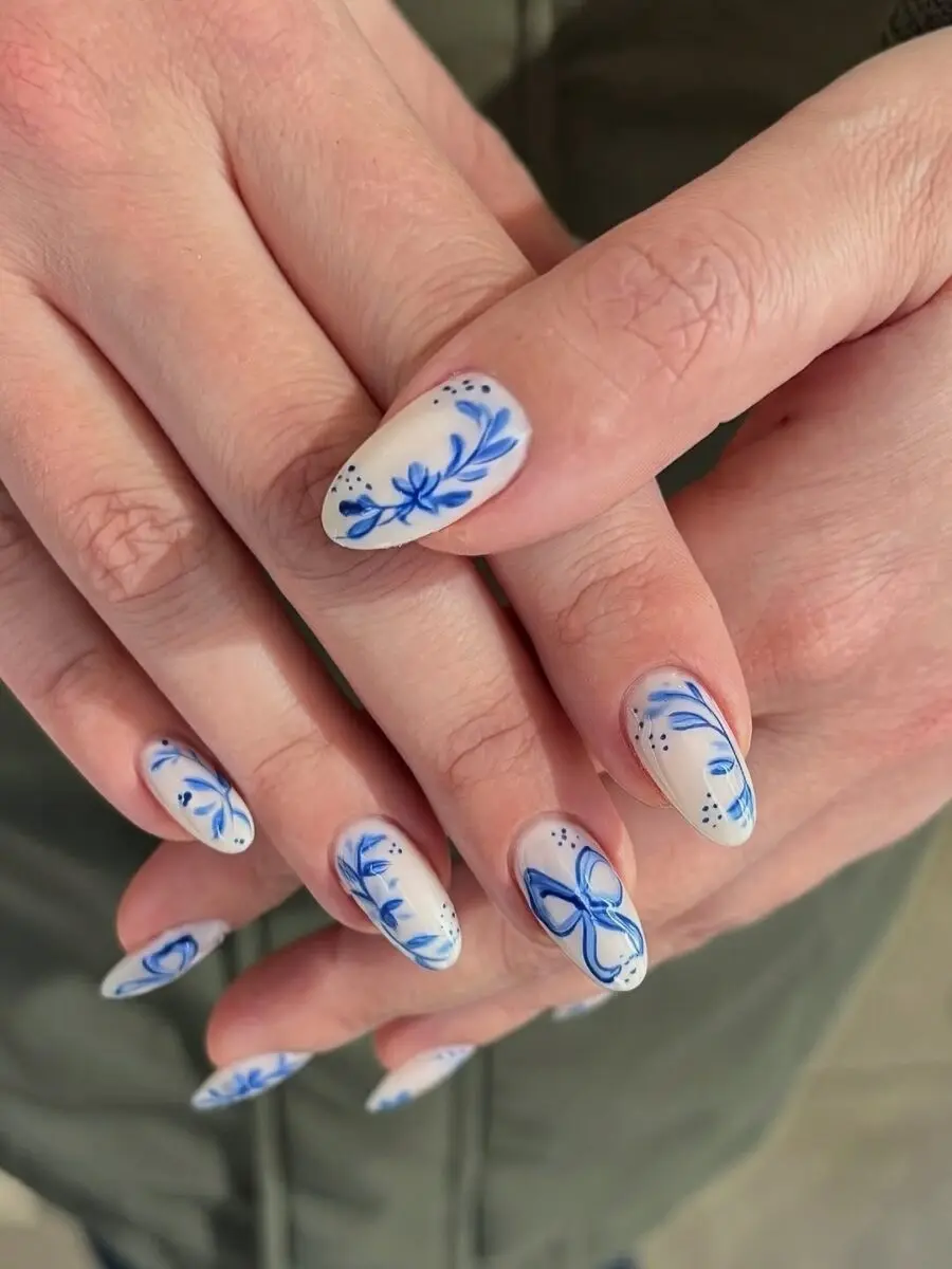 Elegant floral coquette nails with light blue accents
