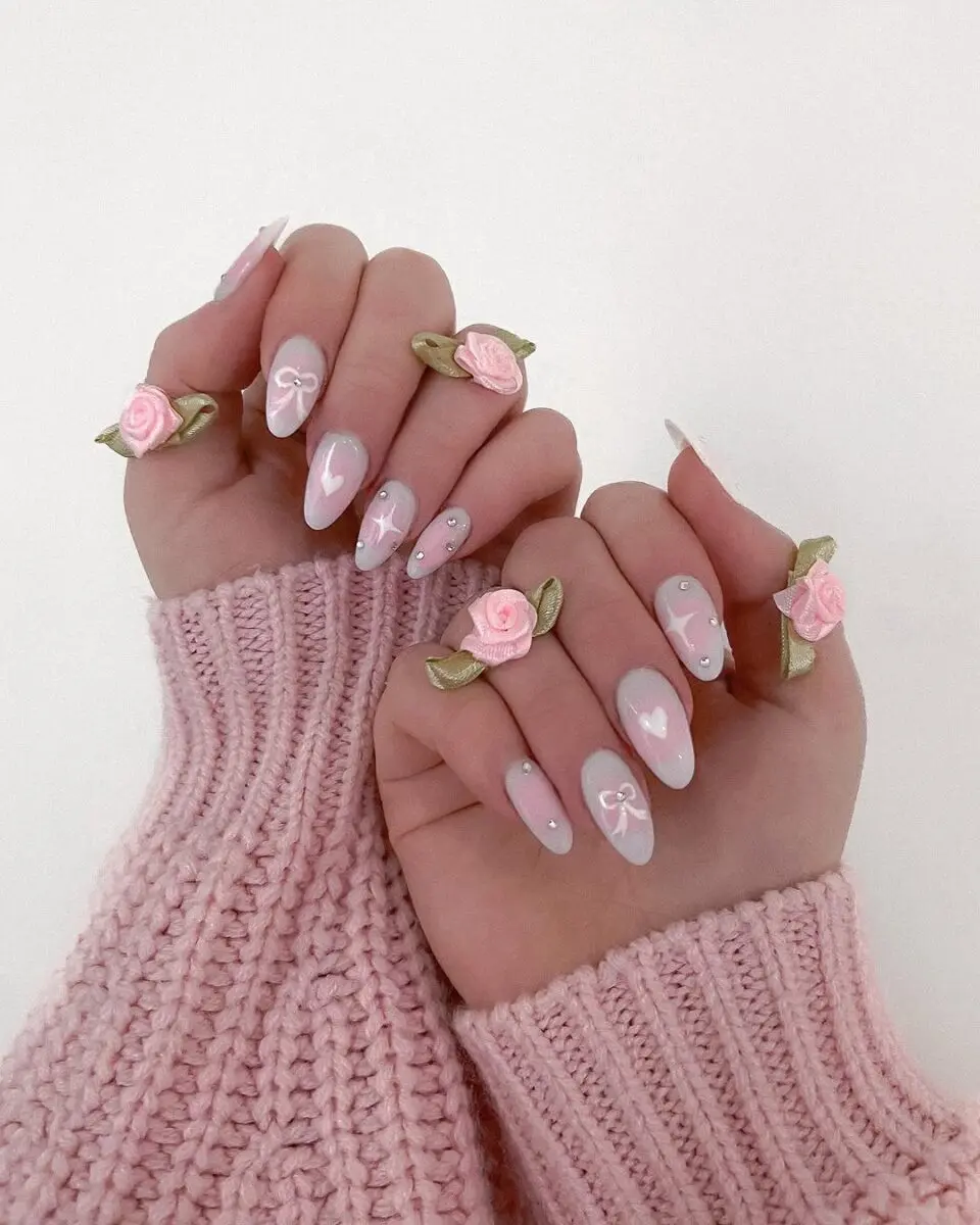 Delicate floral coquette nails with soft pink hues