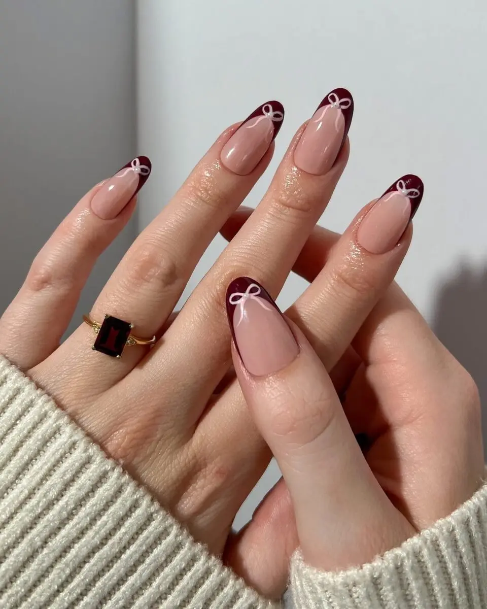 Elegant coquette nails with playful bows