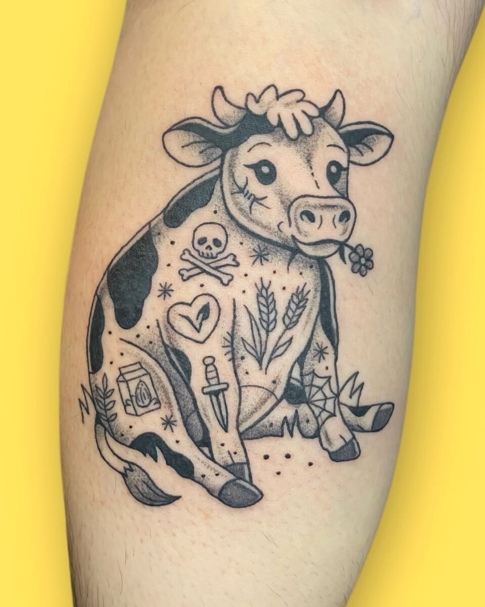 Whimsical cow tattoo with playful elements