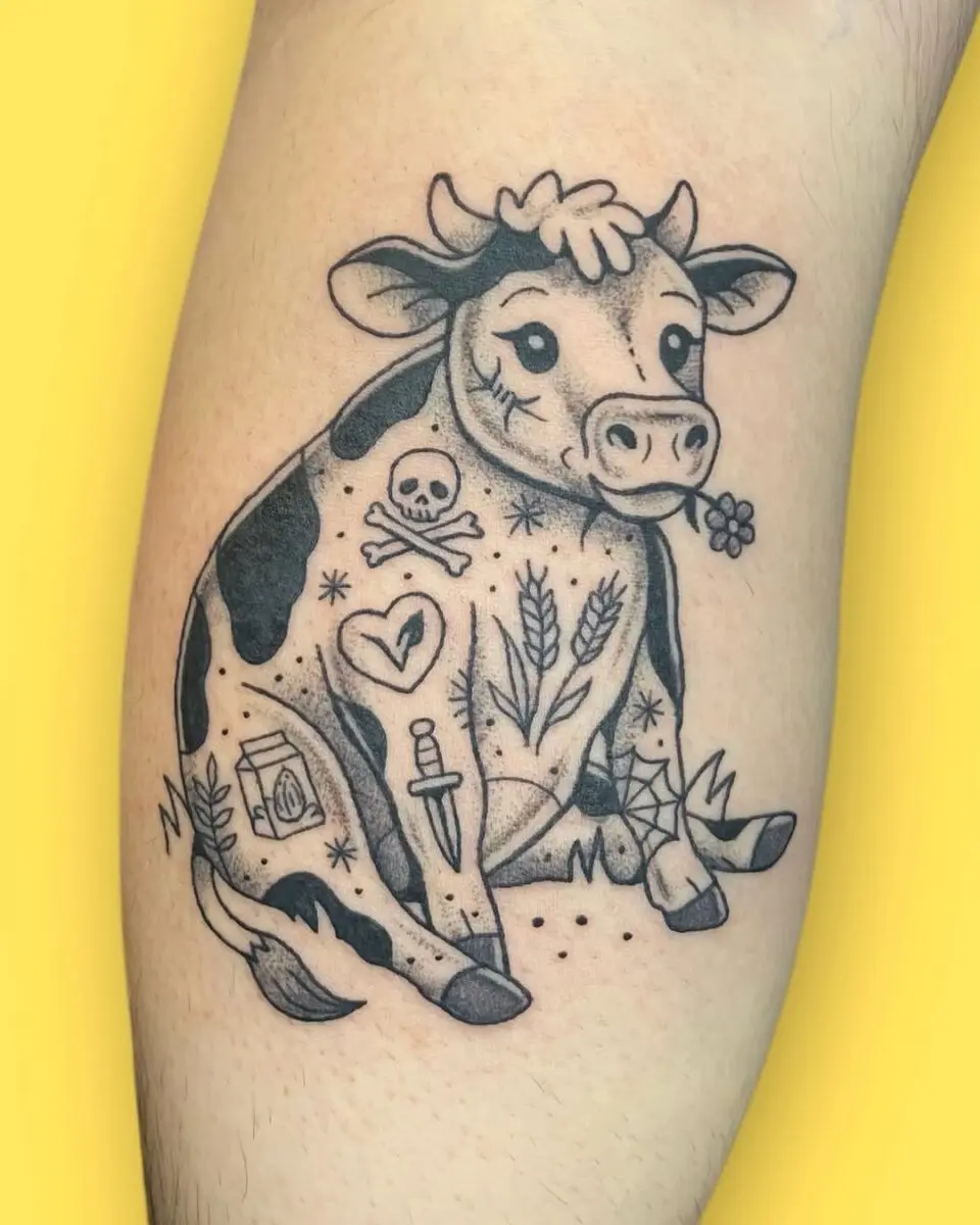 Whimsical cow tattoo with playful elements