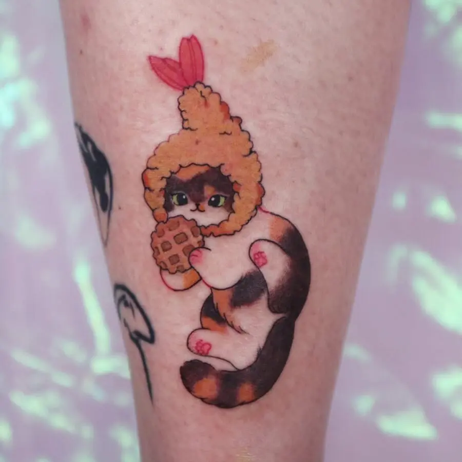 Whimsical Cat Devouring a Waffle Tattoo