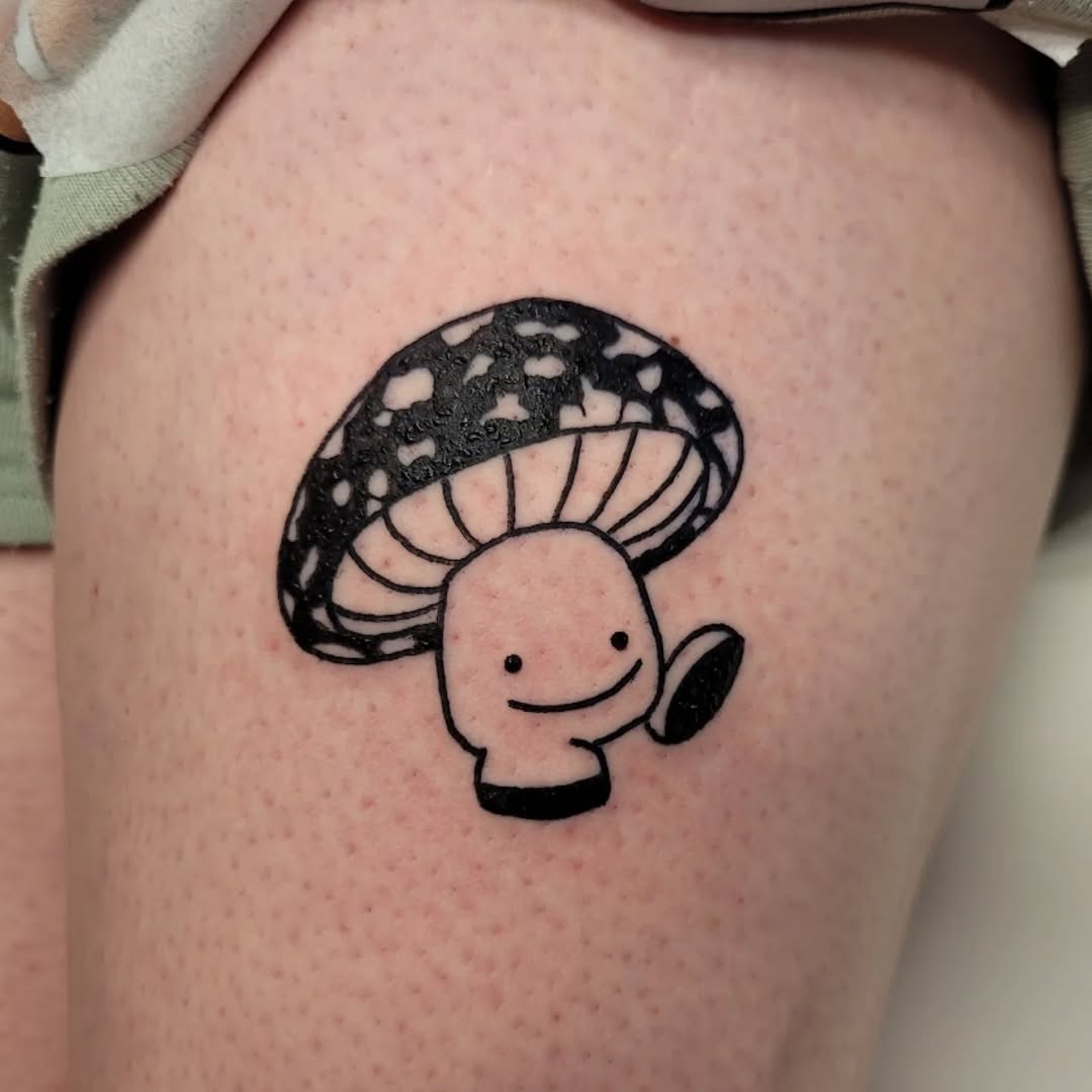 Adorable mushroom tattoo with a whimsical design