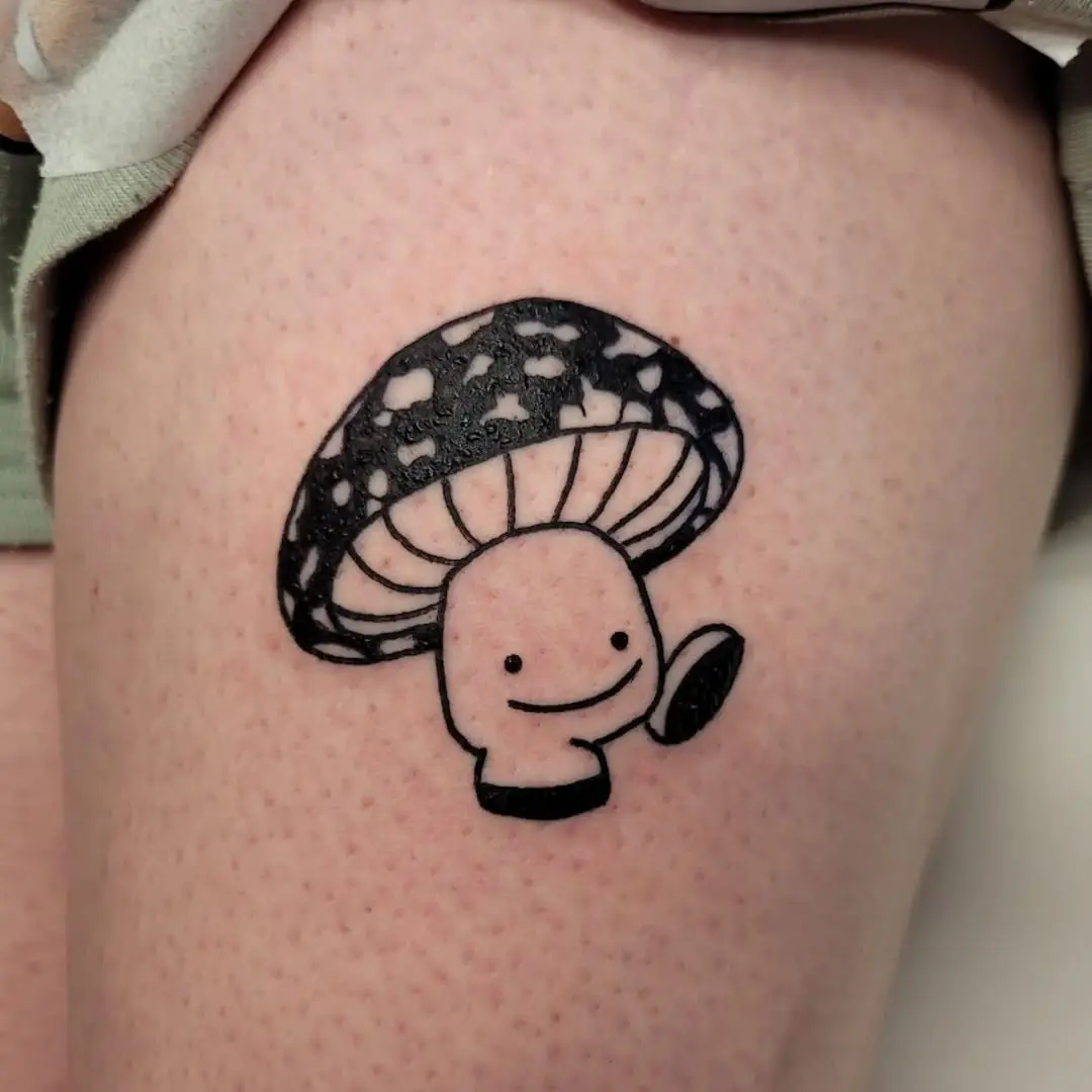 Adorable mushroom tattoo with a whimsical design