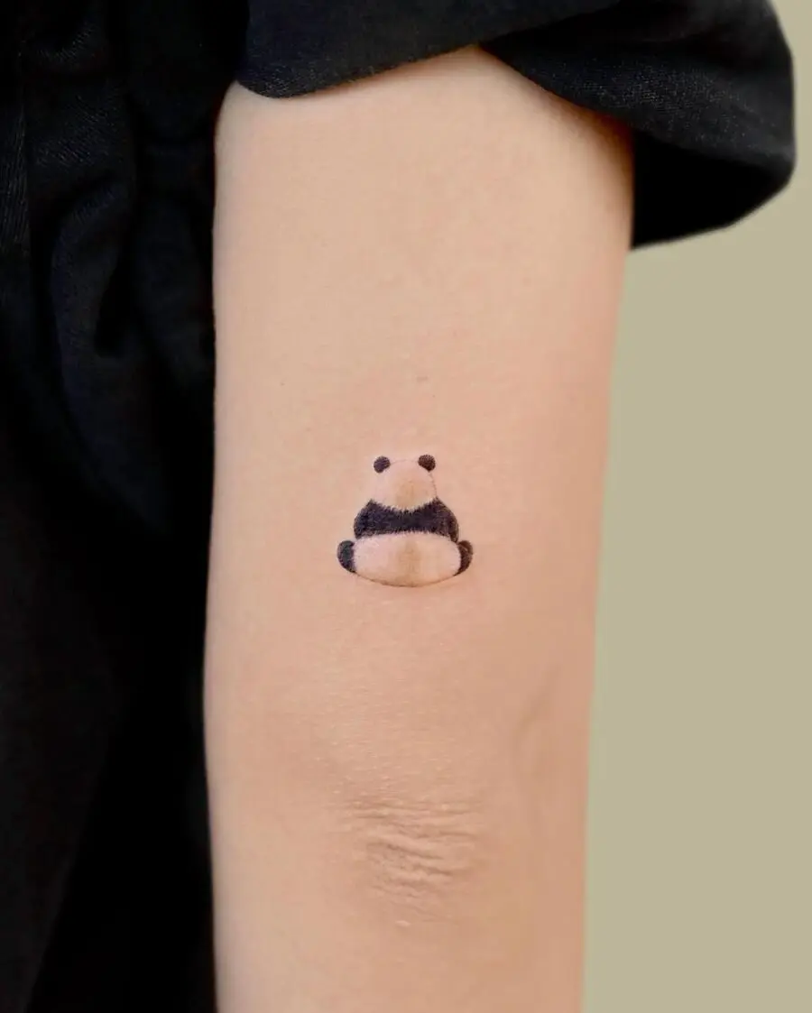 Adorable panda tattoo adding charm to skin.