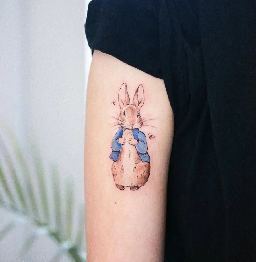 Charming rabbit tattoo in a cozy outfit