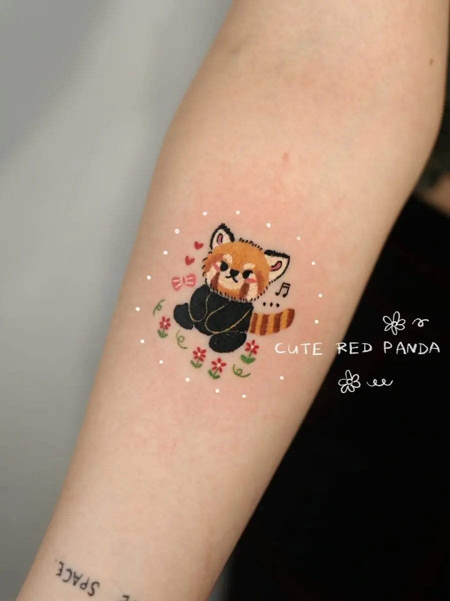 Charming red panda tattoo on display