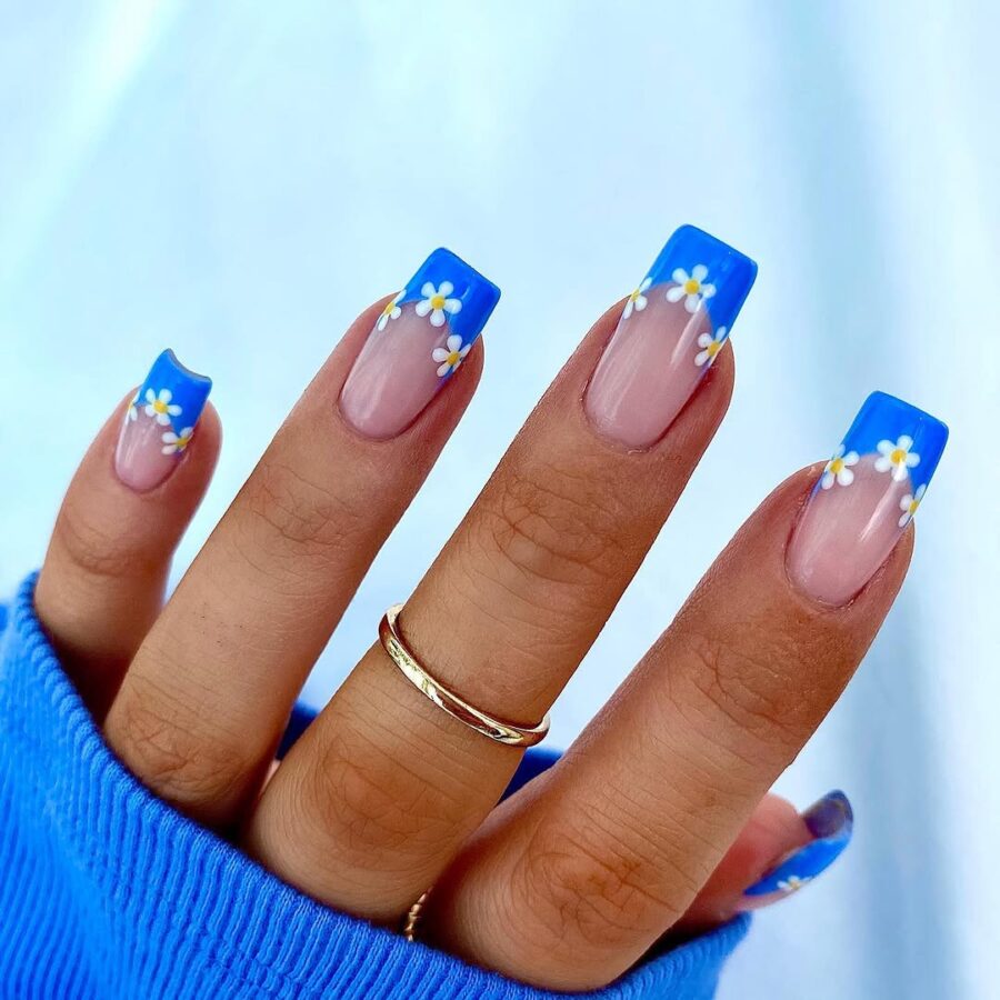 Vibrant Daisy Nails with Blue Tips