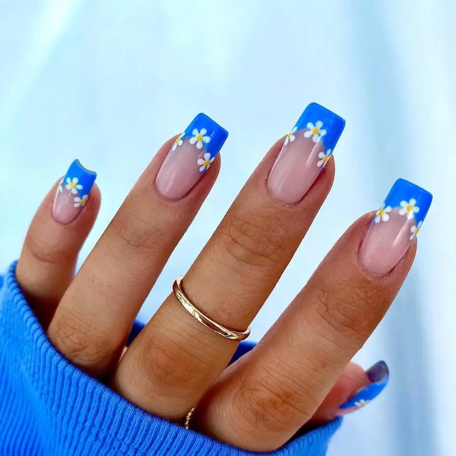 Vibrant Daisy Nails with Blue Tips