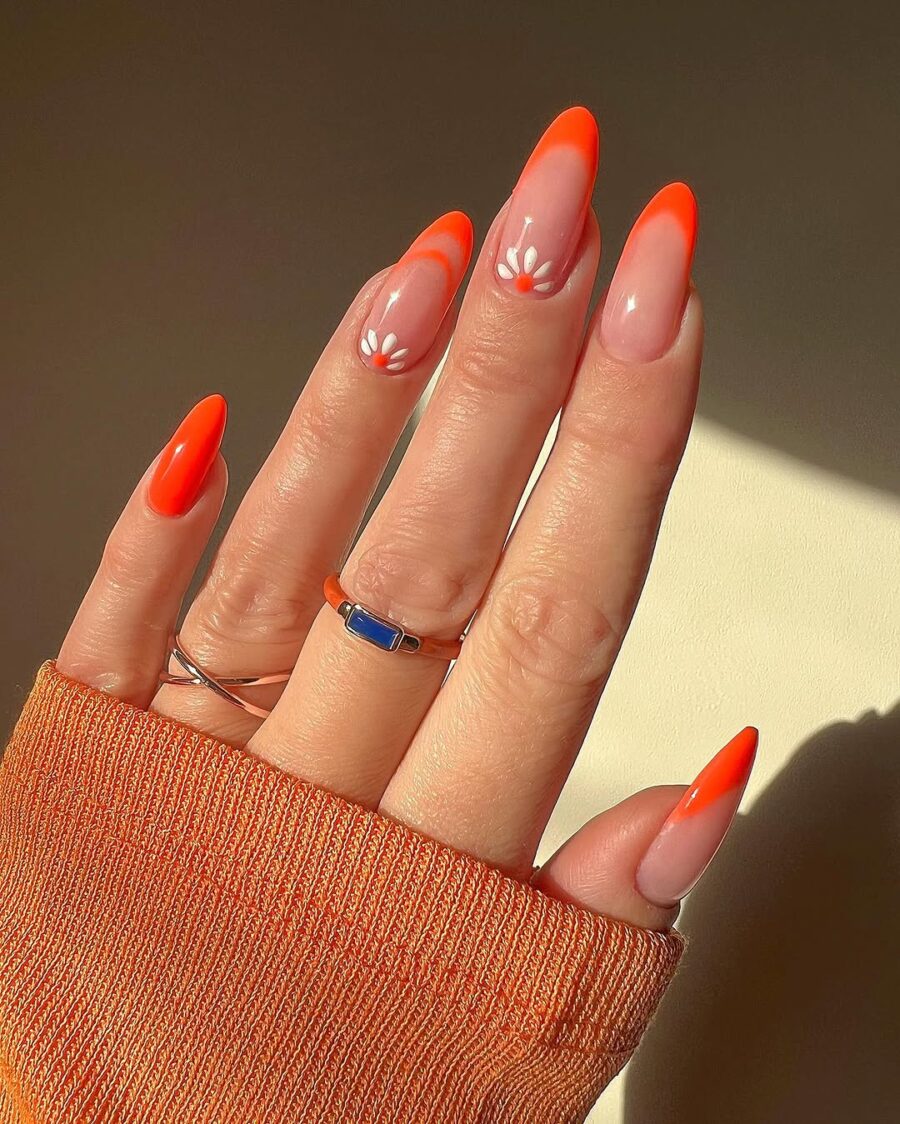 Vibrant orange daisy nail art for summer