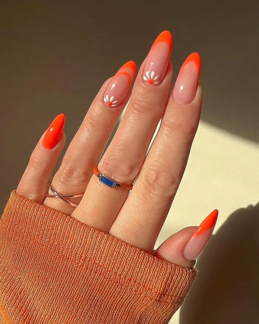 Vibrant orange daisy nail art for summer