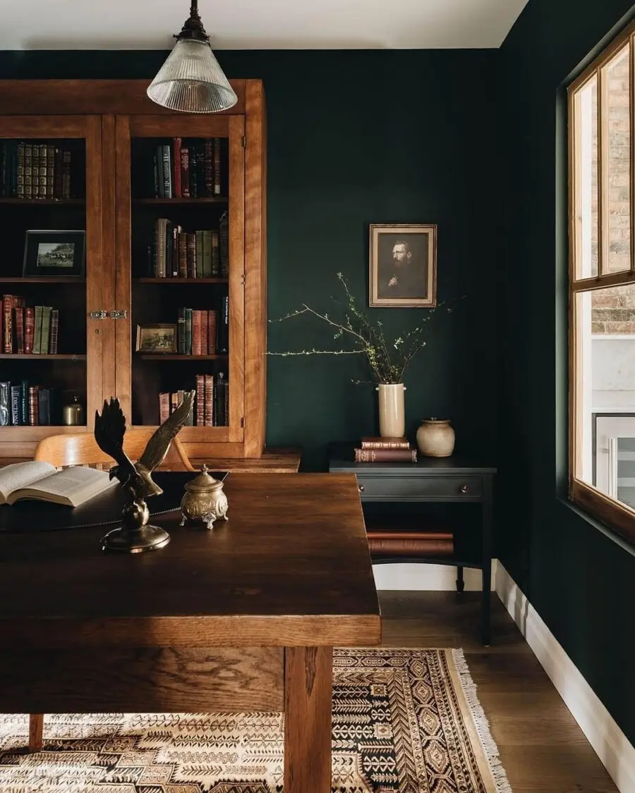 Elegant dark green accent wall with wooden elements