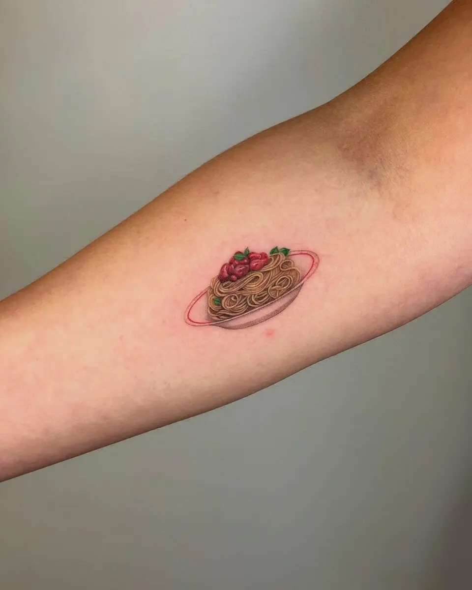 Whimsical pasta tattoo celebrating culinary passion