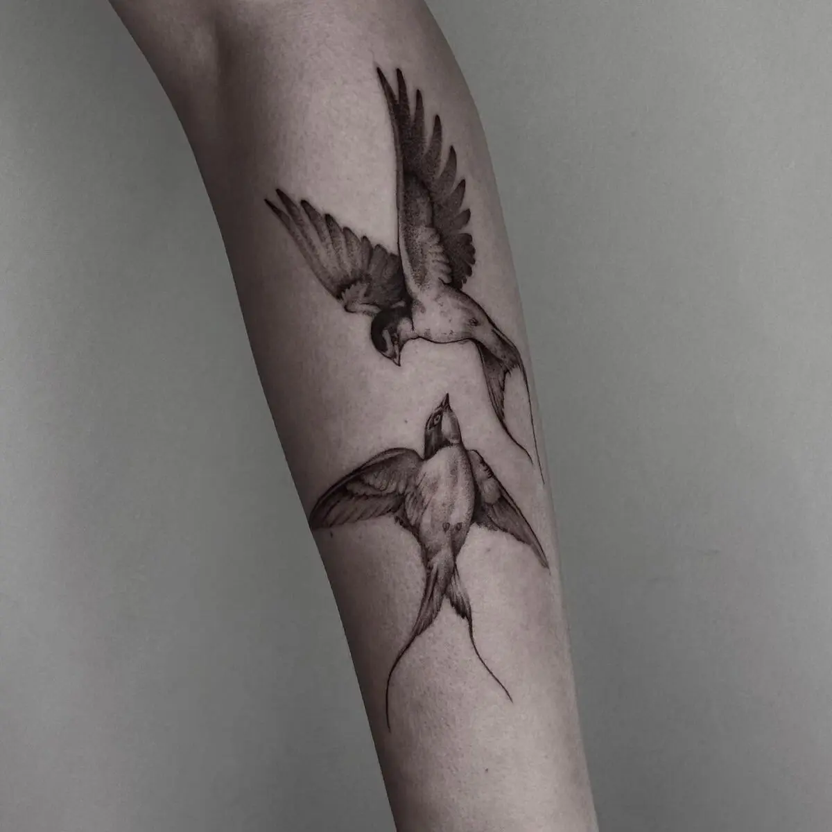 Elegant sparrow tattoos showcasing detailed artistry