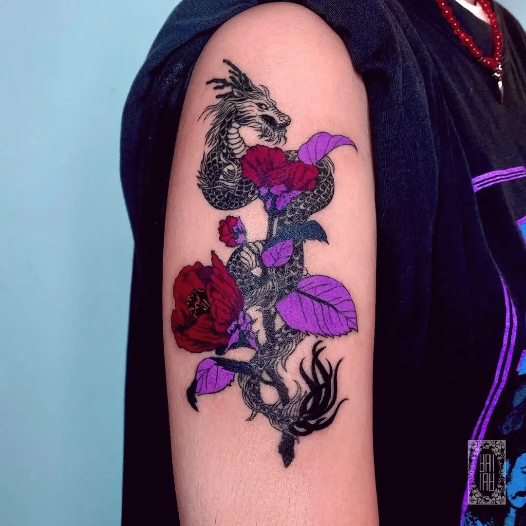 Striking dragon entwined with vibrant camellias