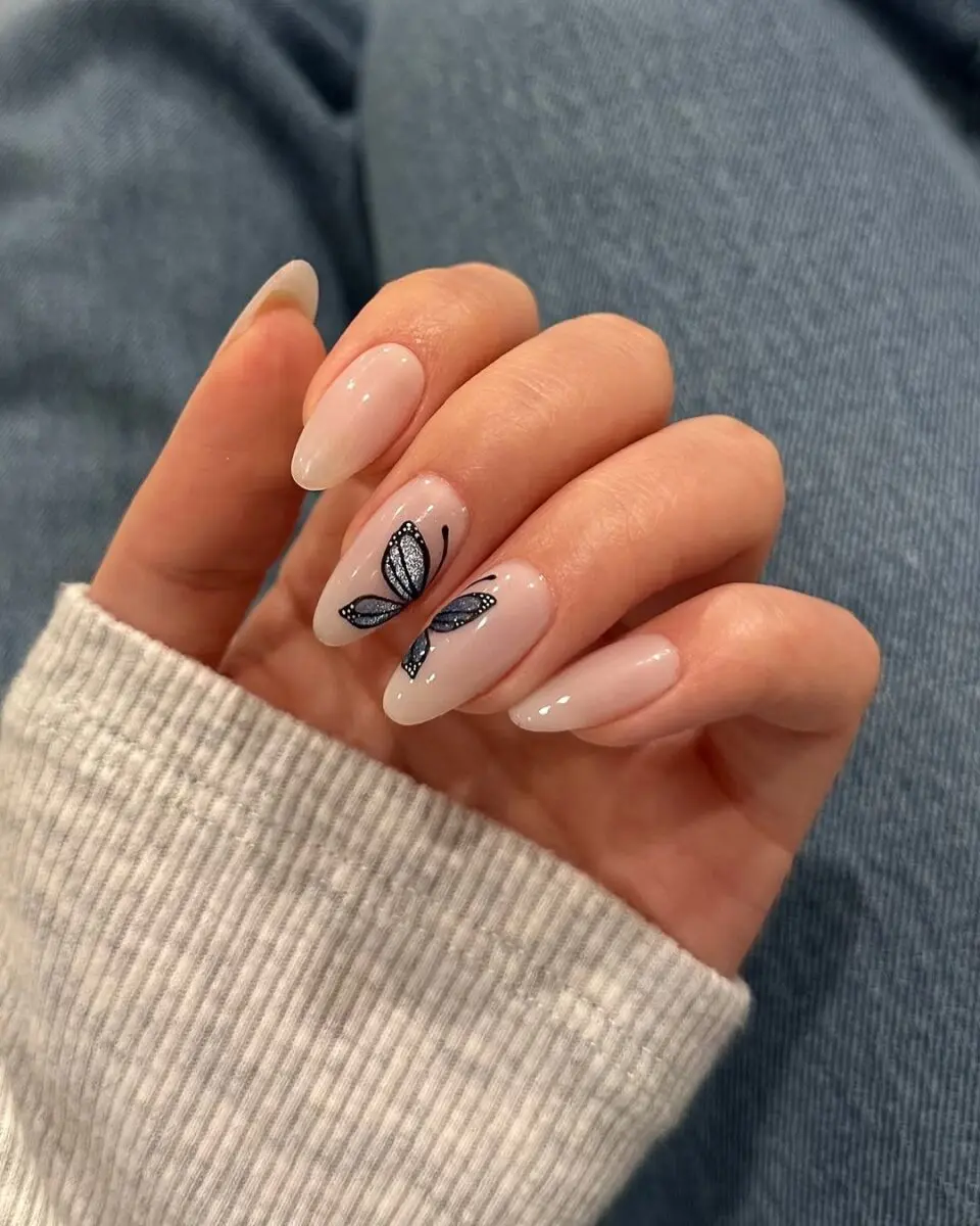 Delicate butterfly nail art for a chic look