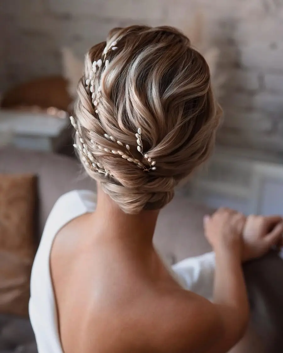 Elegant short bun with delicate hair accessories