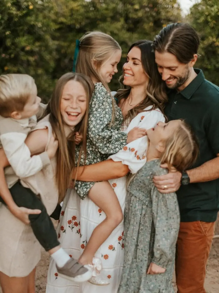 Joyful family in coordinated floral outfits