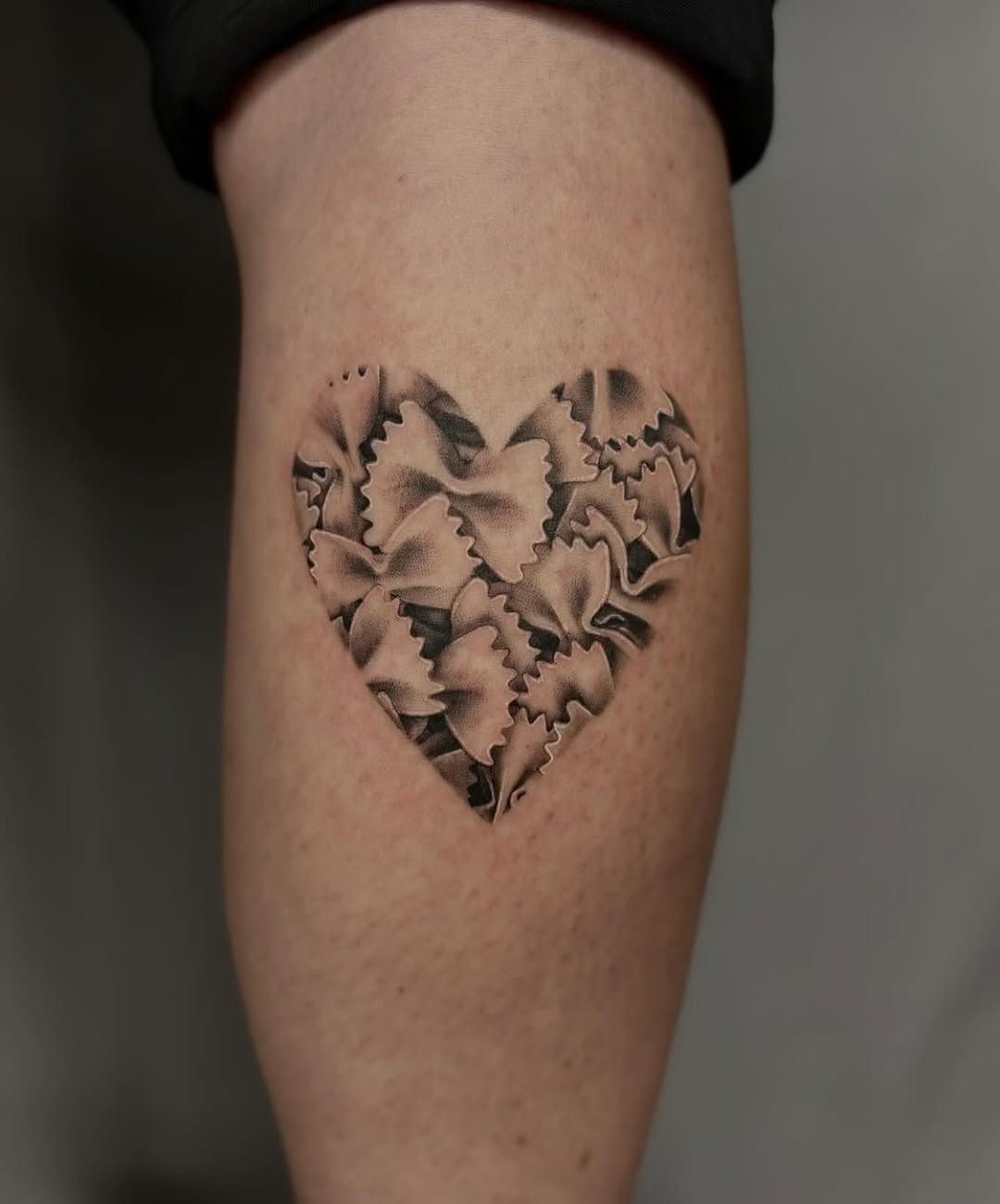 Cute heart made of pasta shapes tattoo