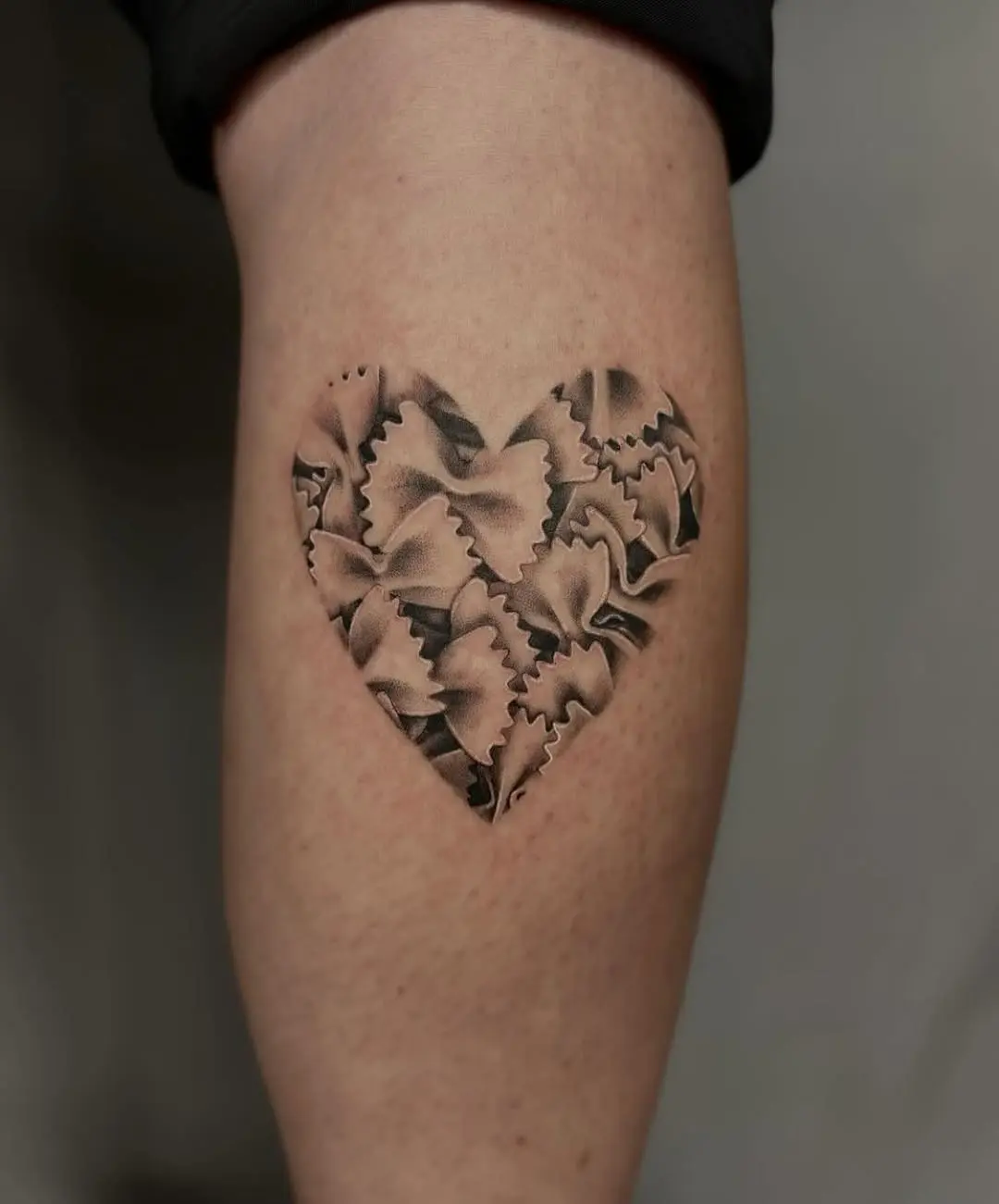 Cute heart made of pasta shapes tattoo