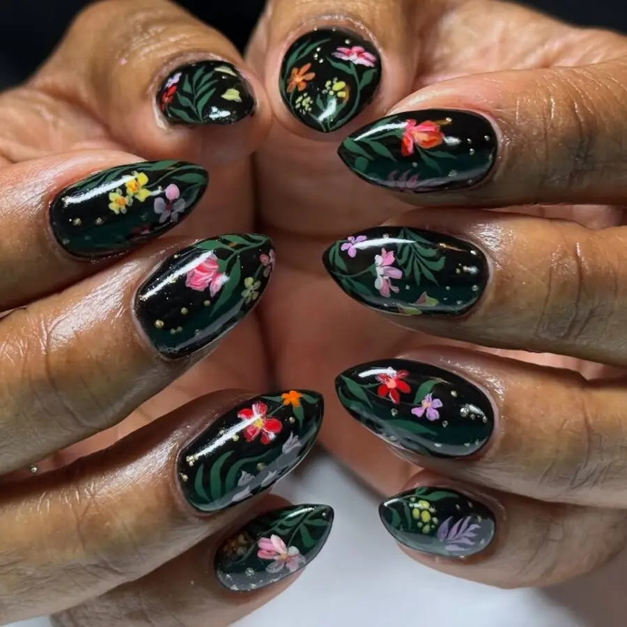 Vibrant floral art on dark nail base