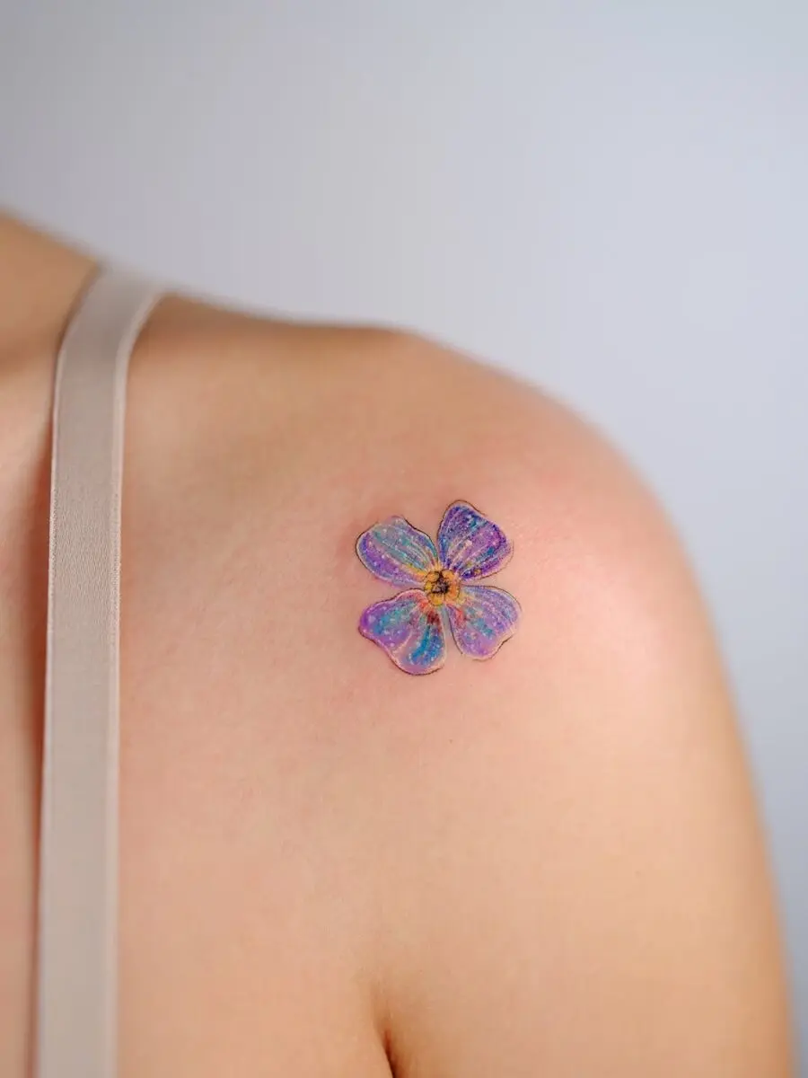 Vibrant floral tattoo exuding tranquility and charm