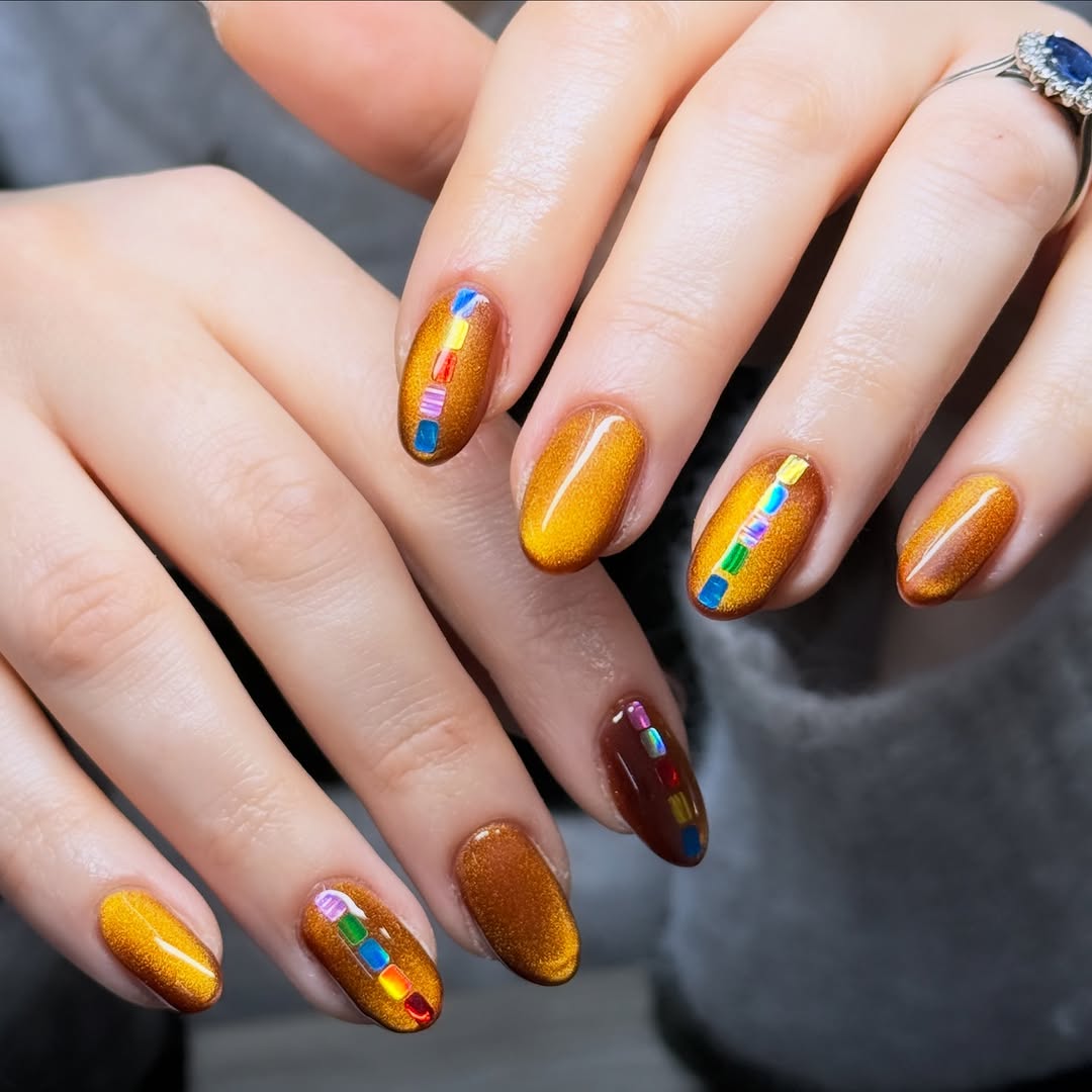 Festive gingerbread-inspired shimmering nail art