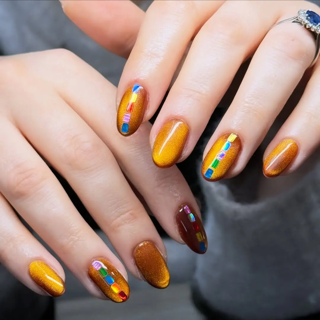 Festive gingerbread-inspired shimmering nail art
