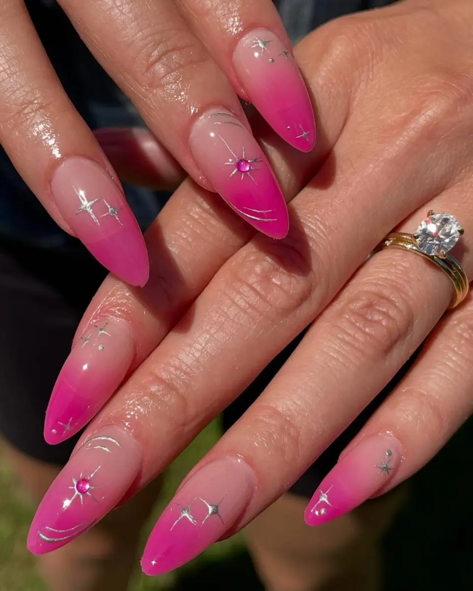 Vibrant hot pink nails with intricate designs