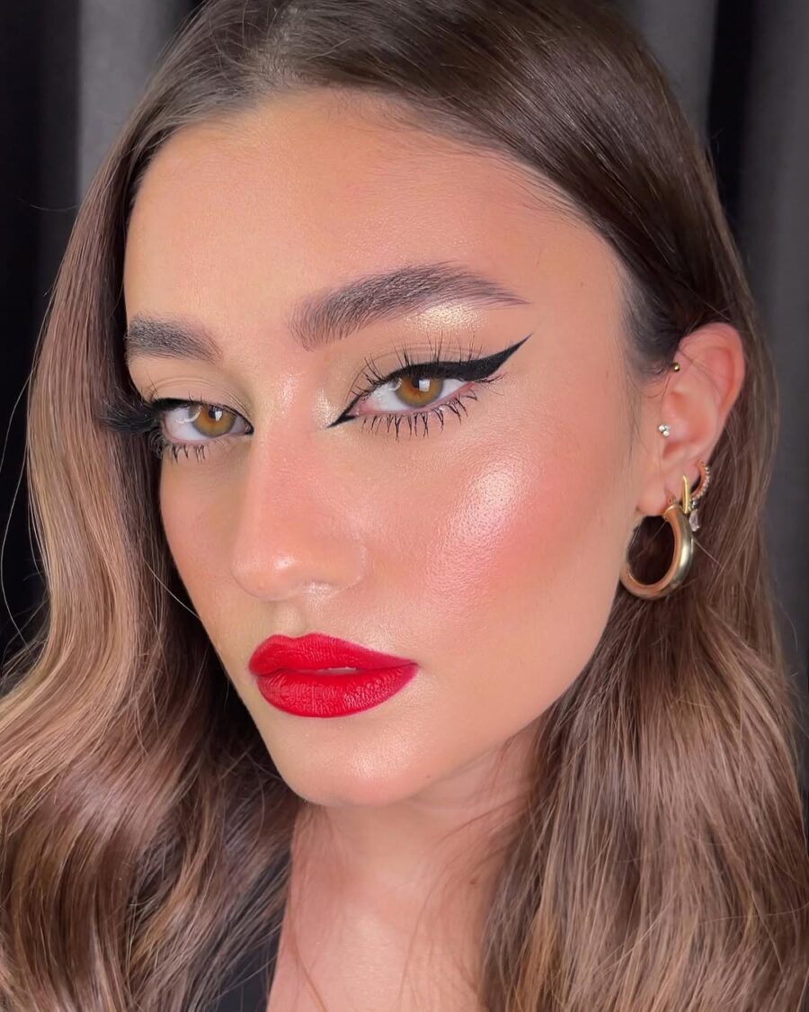 Bold red lips with classic winged eyeliner