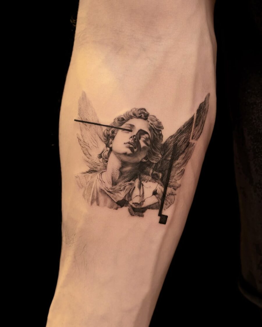 Stunning angelic figure tattoo in monochrome.