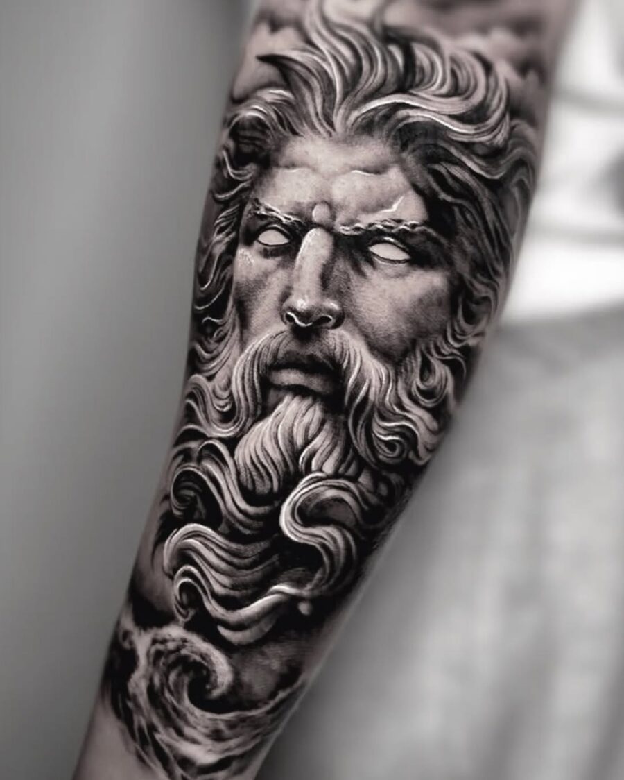 Intricate Zeus portrait tattoo with flowing details