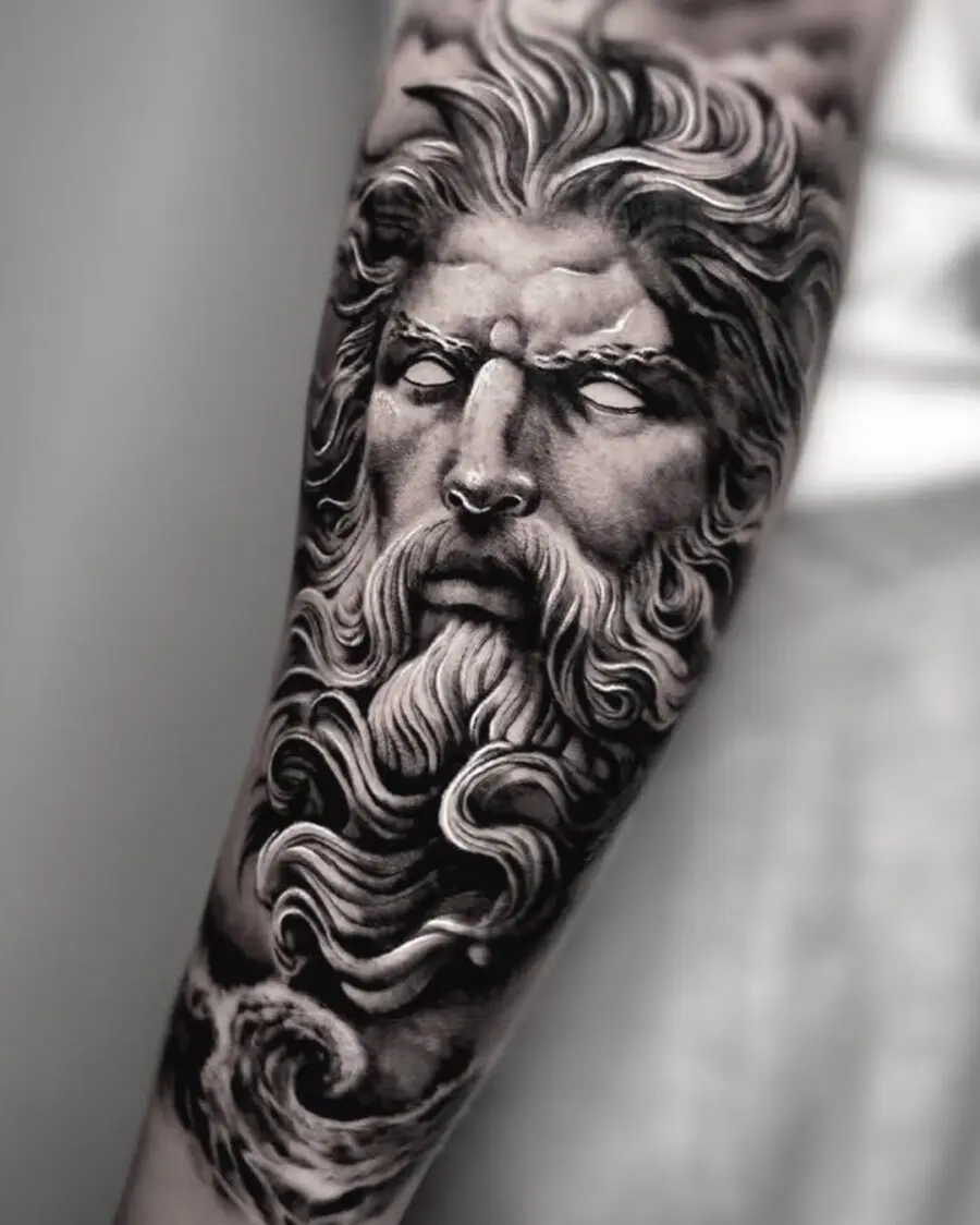 Intricate Zeus portrait tattoo with flowing details