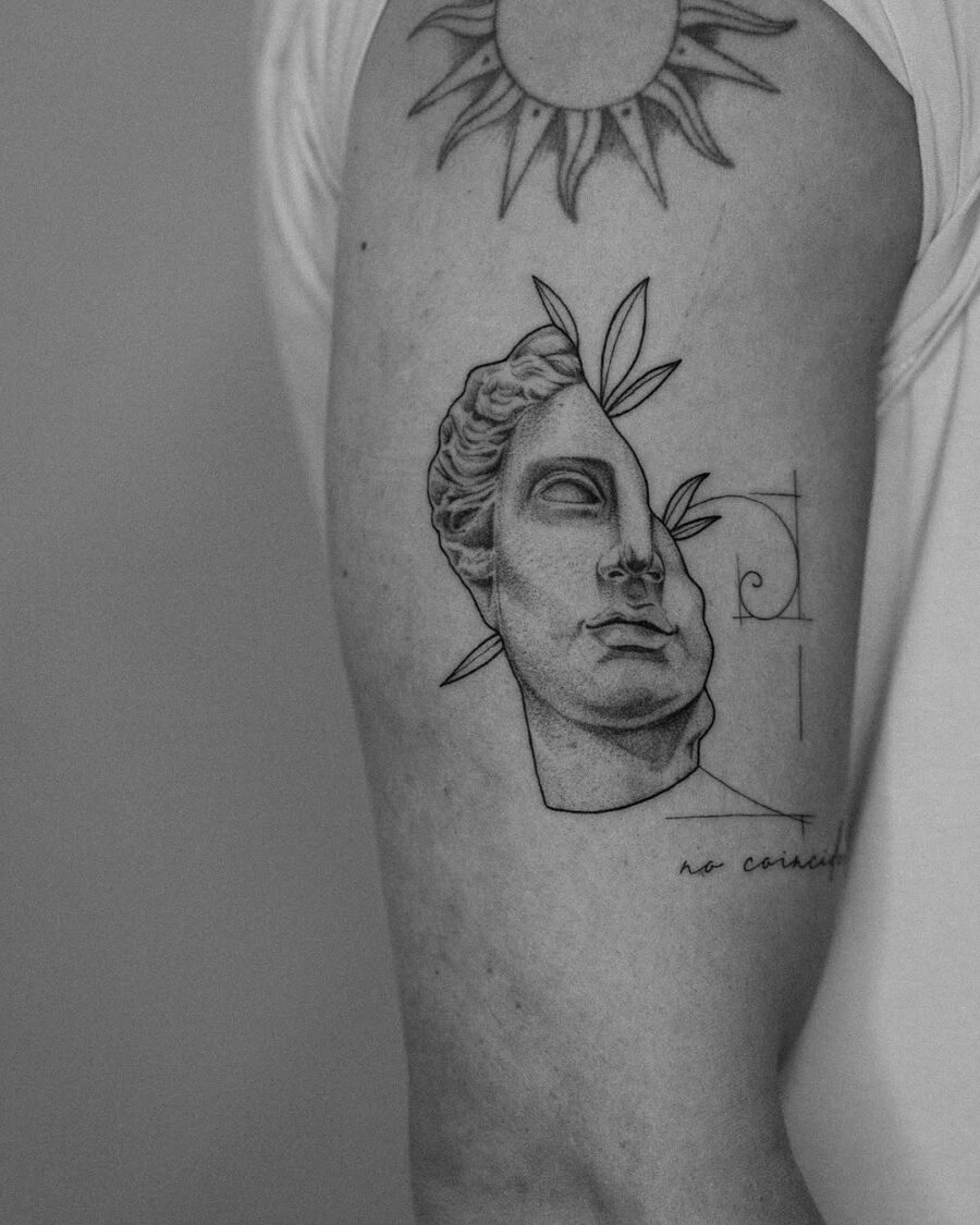 Intricate Greek god tattoo with sun detail