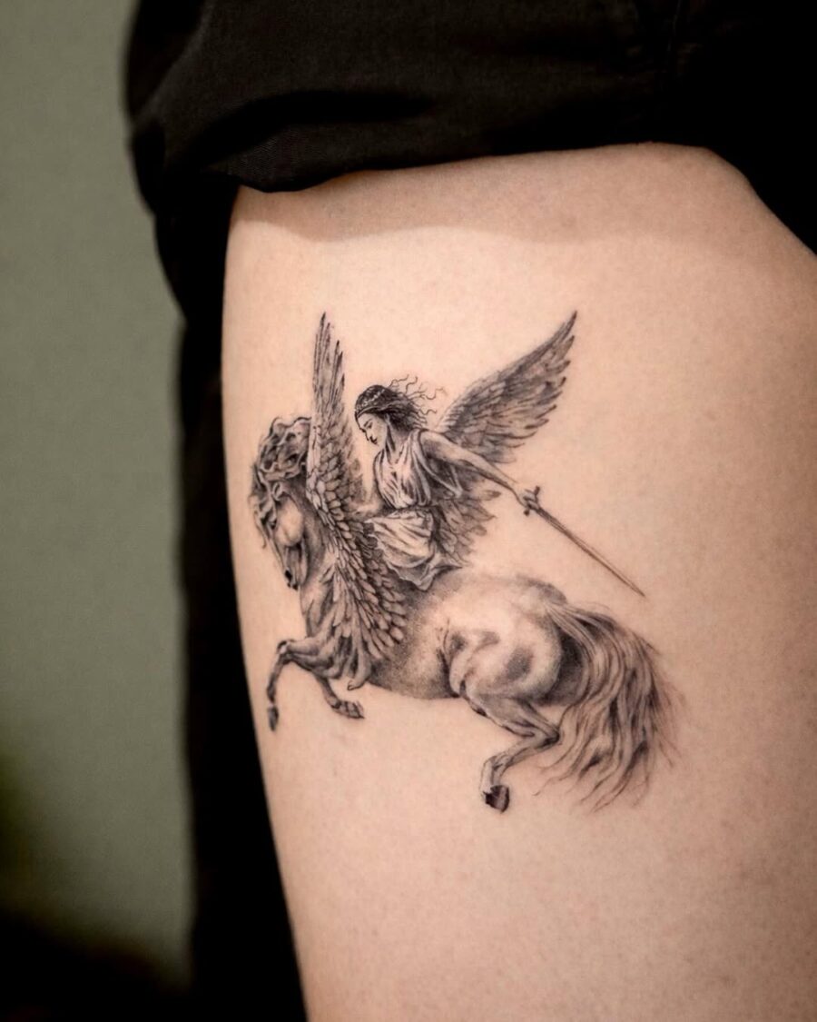 Winged goddess tattoo riding a majestic horse