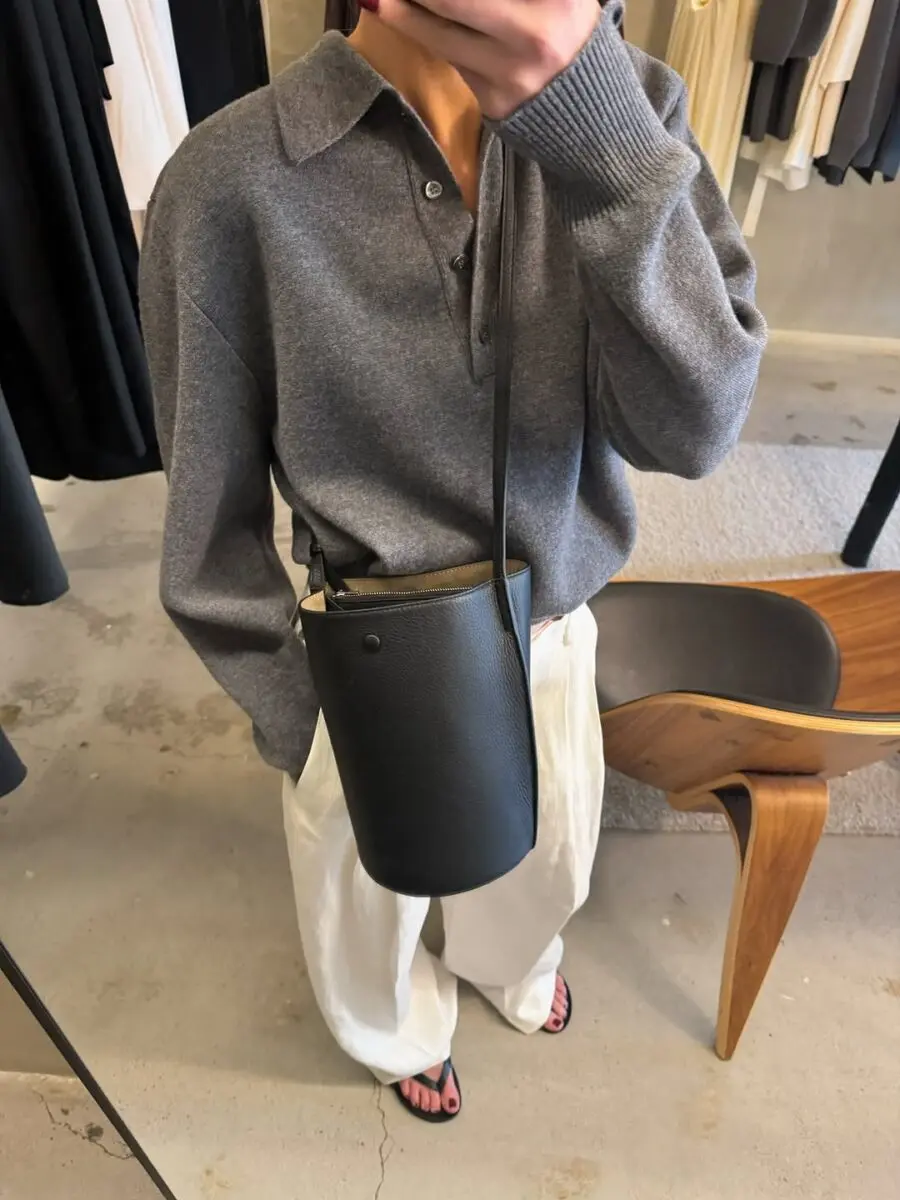 Chic gray sweater with stylish white trousers