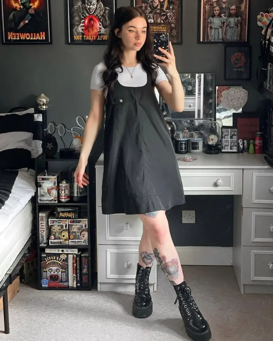 Effortlessly cool black dress with chunky boots