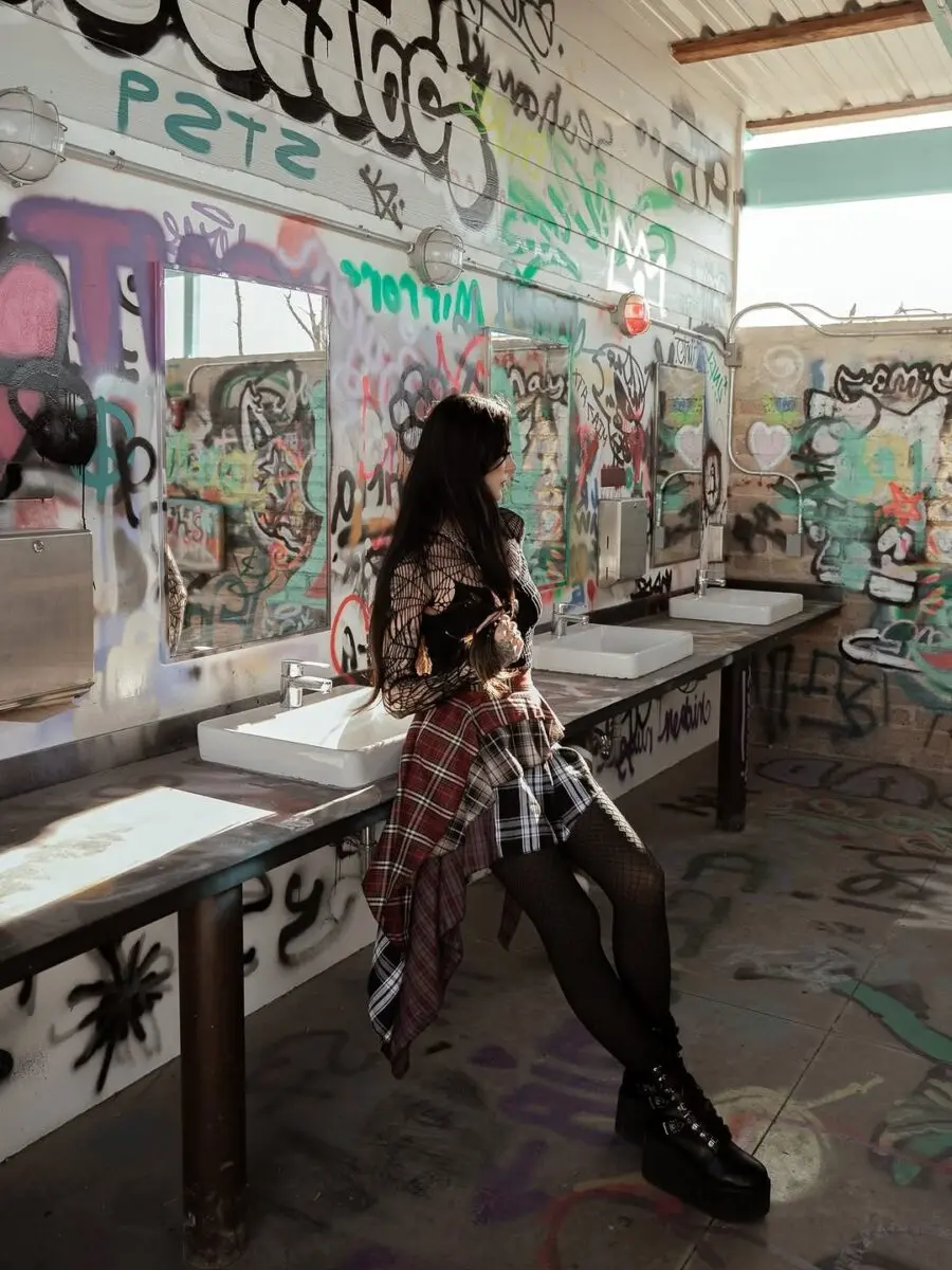 Edgy grunge style with layered textures and prints