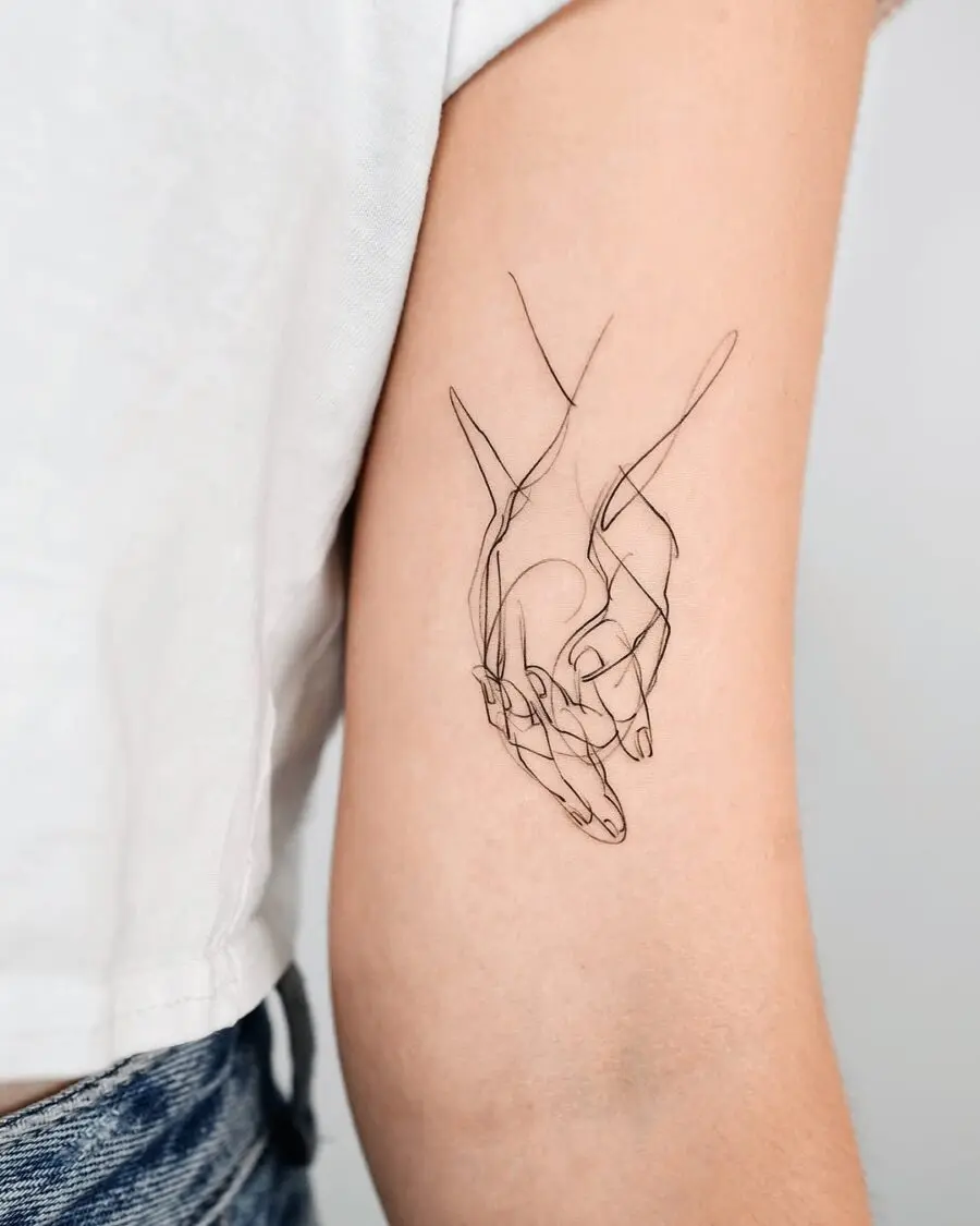 Elegant Minimalist Holding Hands Tattoo Design