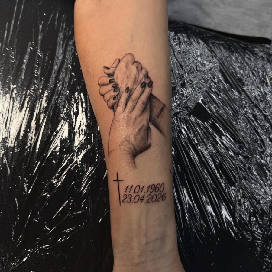 A touching tribute with intertwined hands tattoo