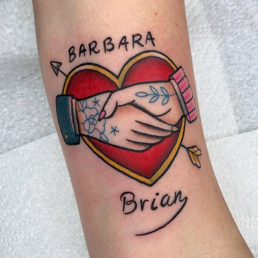 Colorful heart tattoo with joined hands